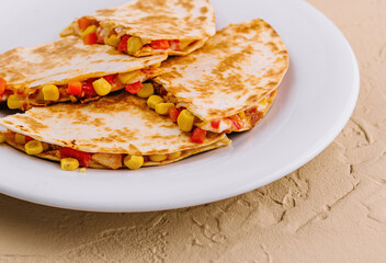 Mexican quesadilla with vegetables on plate