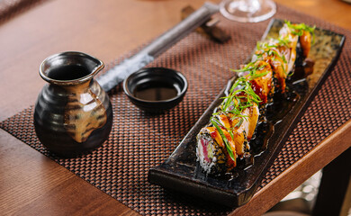 Japanese unagi eel grilled sushi maki roll cutting