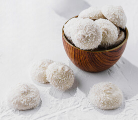 candies in white glaze and coconut flakes