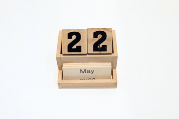 22nd of May wooden perpetual calendar. Shot close up isolated on a white background