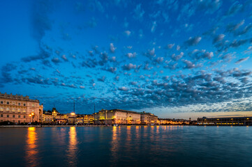 Dusk and night in Trieste. Between historic buildings and the sea. - 725479127