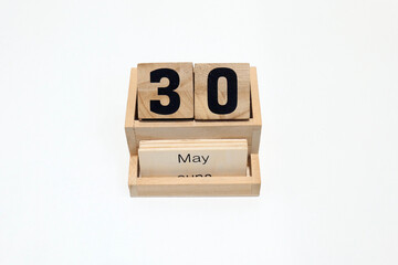 30th of May wooden perpetual calendar. Shot close up isolated on a white background