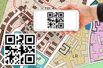 Imaginary cadastral map and General Urban Plan with land parcel - land and property registry - Zoning Regulations and real estate property concept with smart phone and totally invented QR code