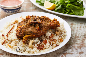 Madfoon Meat mandi rice served in dish isolated on table top view of arabic food