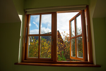 Double glazed wooden window in the autumn 