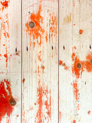 Natural old rustic wooden table top background with the remains of red paint. Top view.