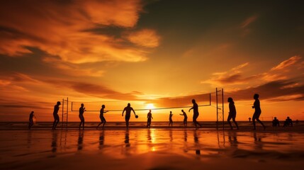 Silhouettes of beach volleyball players on the beach at beautiful sunset.