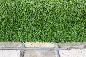 Synthetic grass on tile floor