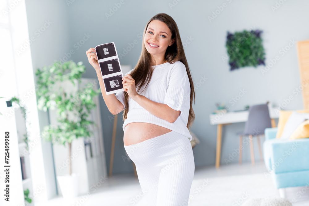 Poster Photo of cheerful sweet nice cute lovely mama pregnant lady showing x-ray diagnostic picture day indoors