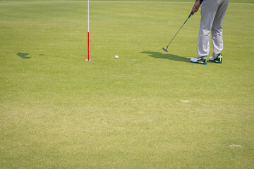 Fototapeta premium Golf ball hitting the hole in one shot of each hole