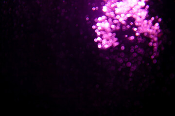Abstract purple bokeh glitter lights defocused