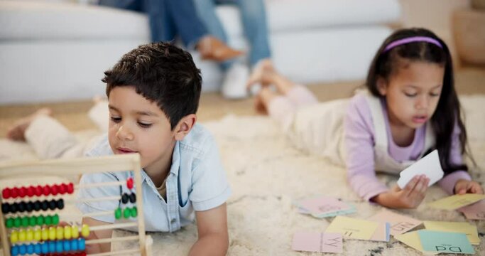 Learning math, cards and children siblings on mat for alphabet lesson for language, phonics or letters. Girl with homework, boy or young kids with abacus for teaching education, literacy or numbers