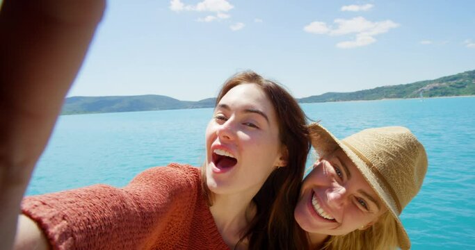 Selfie, travel and smile with friends at sea for social media, memory and explore. Summer, adventure and vacation with women and picture in france beach for holiday, spring break and tourism