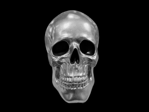 Perfectly shaped silver skull with all teeth on a black background.