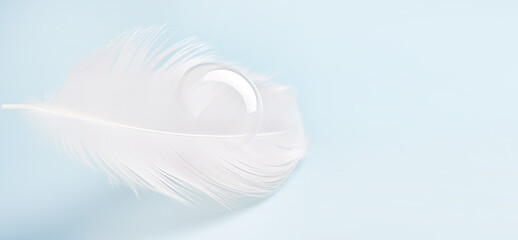 white light feather drop of water blue background