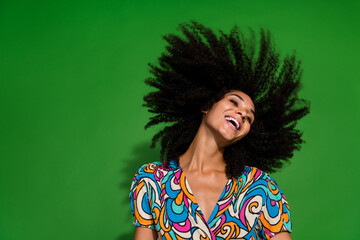 Photo of pretty satisfied young girlfriend shaking head fly hair in air curls laughing cheerful...