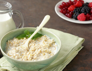 healthy breakfast with whole grain porridge and fresh berries