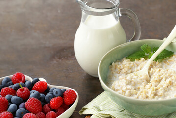 healthy breakfast with whole grain porridge and fresh berries