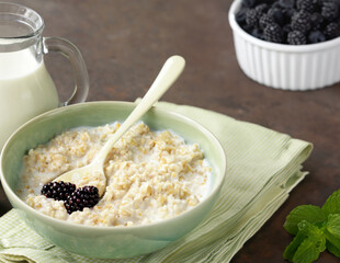 healthy breakfast with whole grain porridge and fresh berries