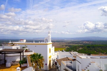 view over the roofs of the white Andalusian houses and the Catholic Church Iglesia de la Merced in...