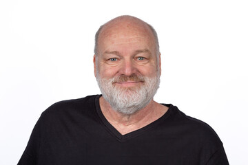 Fototapeta premium Cheerful Middle-Aged, Bearded Man in Stylish Black T-Shirt Smiling on White Background, Look in to Camera
