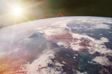 View of Earth planet in outer space with sunlight. Elements of this image furnished by NASA. © Paopano