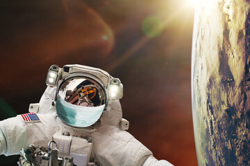 Astronaut with face mask protect in outer space. World medical concept. Elements of this image...