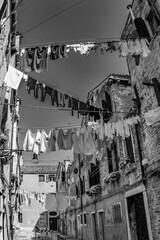 clothes on a clothesline in a narrow street in Venice