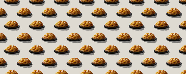 Seamless pattern of onion rings in batter on wooden plate with shadow isolated on beige background.