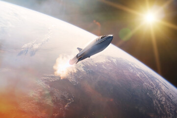 Star ship taking off on a mission on background of Earth planet. Elements of this image furnished by NASA.