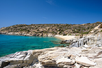 Fototapeta na wymiar View of the most amazing turquoise beach of Pikri Nero, on a beautiful day on the island of Ios Greece