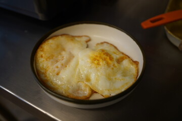 Two fried eggs on a plate
