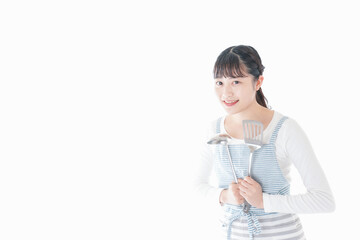 クッキングをする若い女性