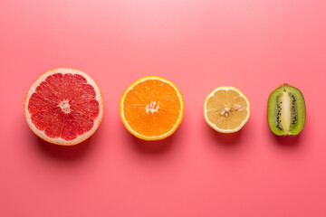 Creative fruit composition on pink background with hard shadows. Summer minimal concept.