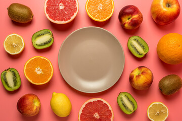 Creative fruit composition on pink background with hard shadows. Summer minimal concept.