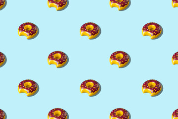 Inflatable doughnut pool toy pattern on pastel blue background. Minimal summer concept. Flat lay.
