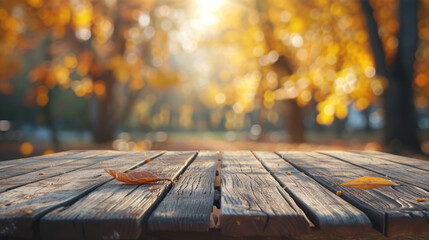 The empty wooden table top with blur background of autumn. Exuberant image. - obrazy, fototapety, plakaty