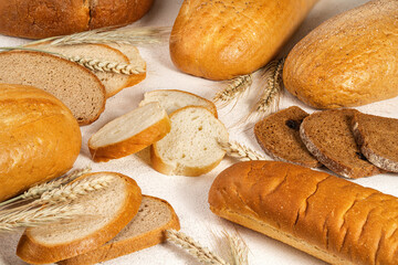assortment of baked bread, light background, no people,  close-up