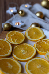 New Year's layout of oranges, board, napkins, garlands and balloons on the kitchen table.Preparations for the holiday.Preparing for the celebration of Christmas.The concept of a cozy kitchen