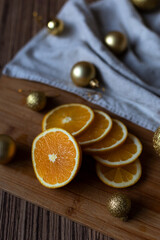 New Year's layout of oranges, board, napkins, garlands and balloons on the kitchen table.Preparations for the holiday.Preparing for the celebration of Christmas.Cooking dried oranges