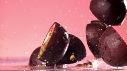 Fresh tropical passion fruit falls on a wet table. Filmed on a high-speed camera at 1000 fps. High quality FullHD footage