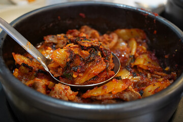 Korean style Pork Stew is a local Korean food made with pork and kimchi stewed in a spicy and salty way.