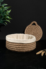 knitted jute basket on a dark background