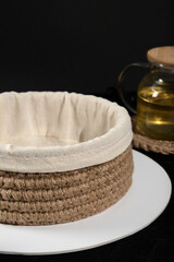 knitted jute basket on a dark background