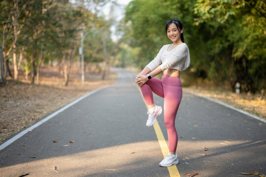 Woman stretching before jogging Health and lifestyle.