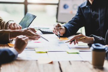 Business people brainstorming discussion on investment strategy analysis and business planning.