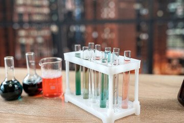 Group of laboratory flasks and beaker for experiment with color liquid in science laboratory