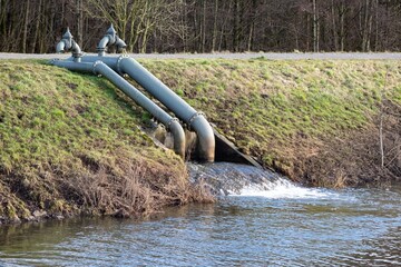 pumping station on a river with dike