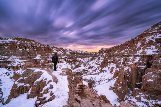 A lone hiker at Cathedral Gorge State Park in the winter 
