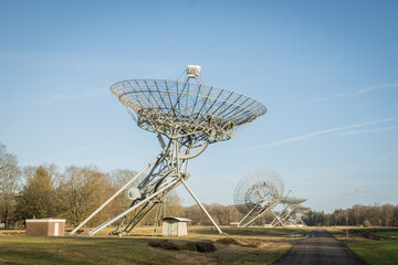 Westerbork Synthesis Radio Telescope WSRT parabolic antennas are astronomy observatory. Radio telescopes astronomical observations in forest of Drenthe Netherlands near preserved nazi Kamp 